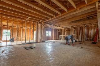 Residential home addition construction reference with interior framing in progress.