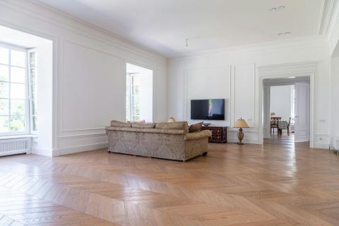 Bright interior room remodeling reference with modern TV wall and clean finishes.