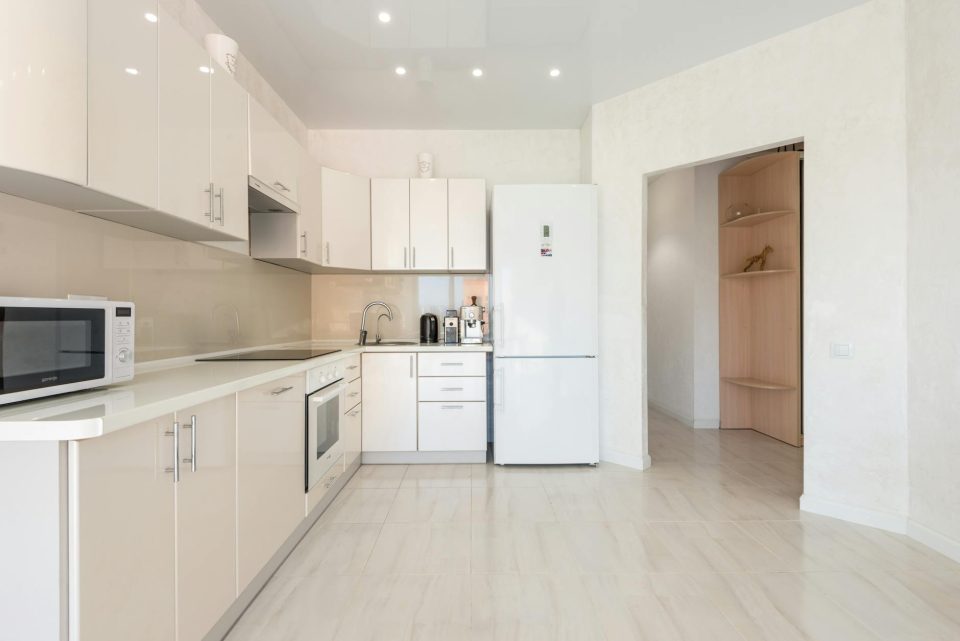 Kitchen cabinet layout reference with built-in oven and clean counters.